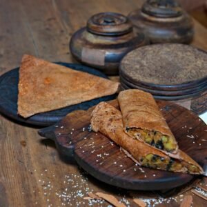 Savor the authentic taste of Indian dosas and chutney, served on rustic wooden platters.